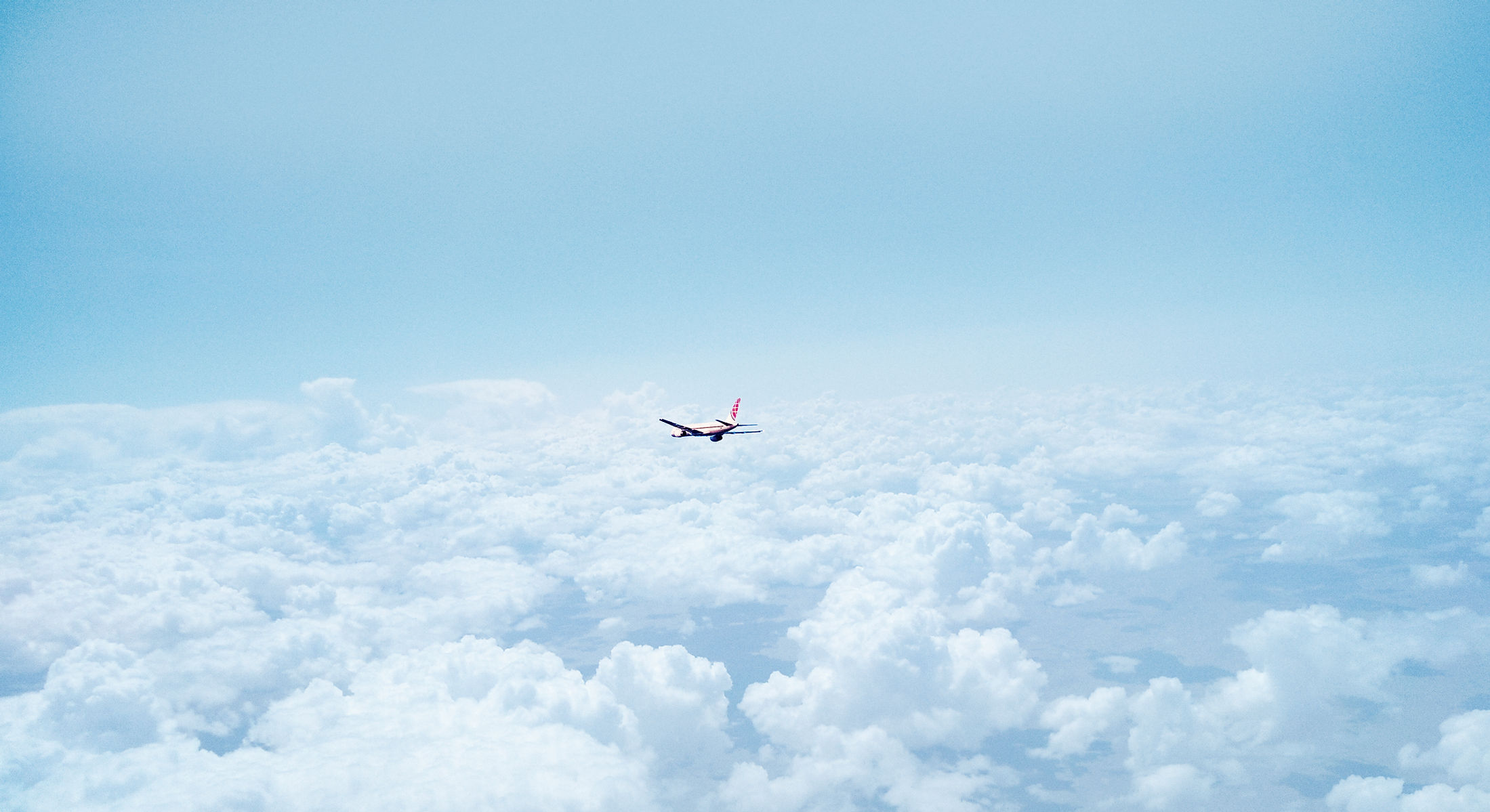 Airplane Above the Clouds